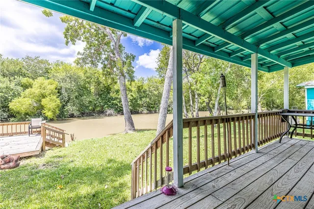 a view of balcony with wooden floor