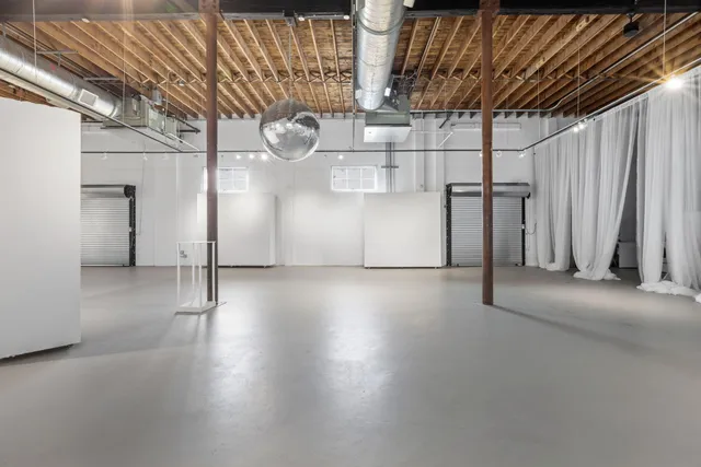 a view of a room with wooden walls