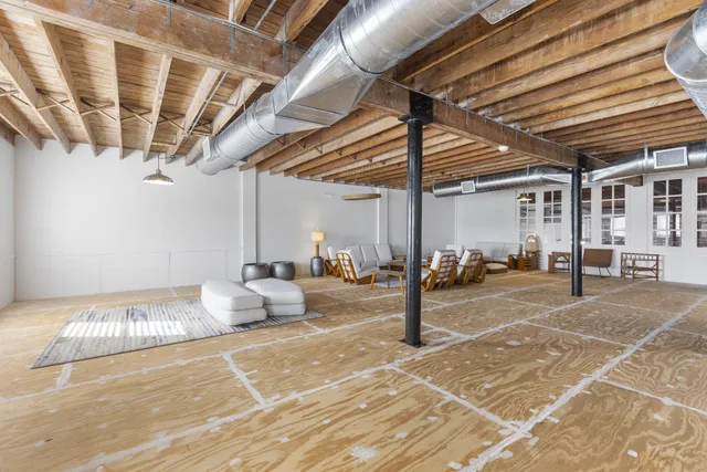 a outdoor space with lots of white furniture and shower