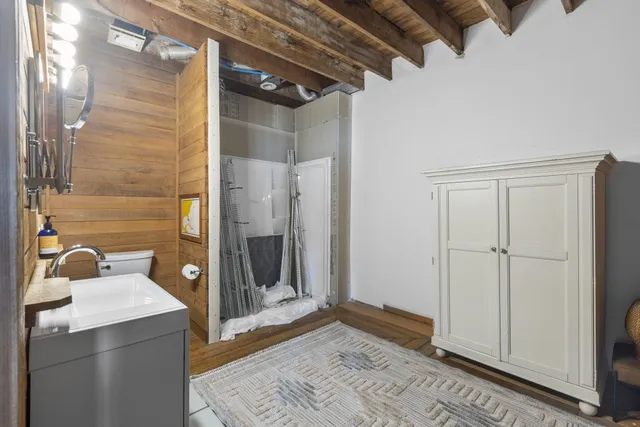 a bathroom with a sink and shower