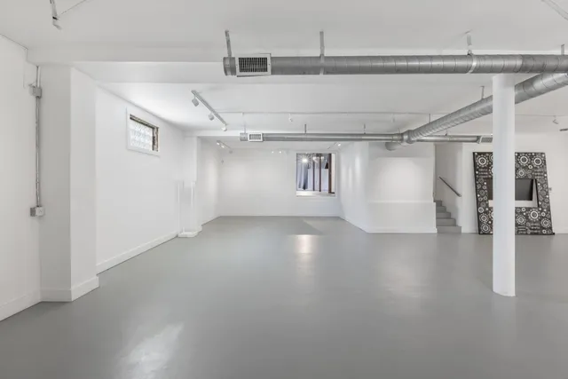 a view of a livingroom with wooden floor
