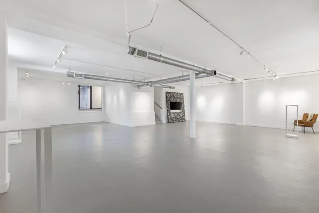a view of a livingroom with wooden floor