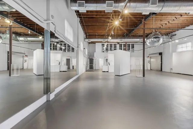 a view of a hallway with stairs