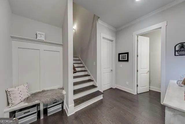 a view of entryway with livingroom and wooden floor