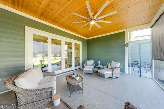 a outdoor space with patio the couches and a dining table with garden view
