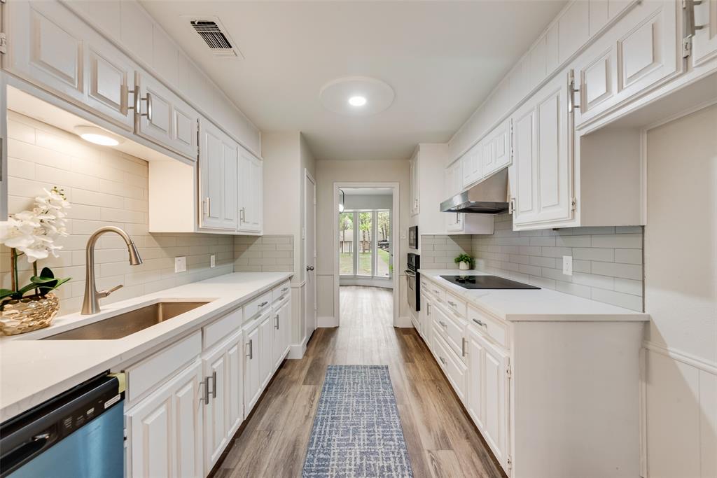4801 Rock Ridge Court Arlington, TX 76017 - Photo 11 of 27 a large kitchen with a sink and cabinets