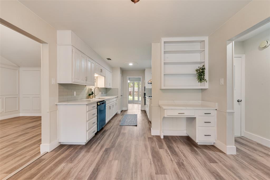 4801 Rock Ridge Court Arlington, TX 76017 - Photo 12 of 27 a kitchen with white cabinets and white appliances