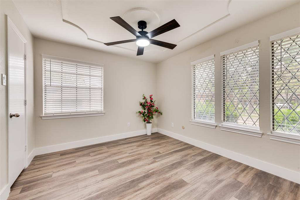 4801 Rock Ridge Court Arlington, TX 76017 - Photo 19 of 27 a view of a livingroom with a ceiling fan and window
