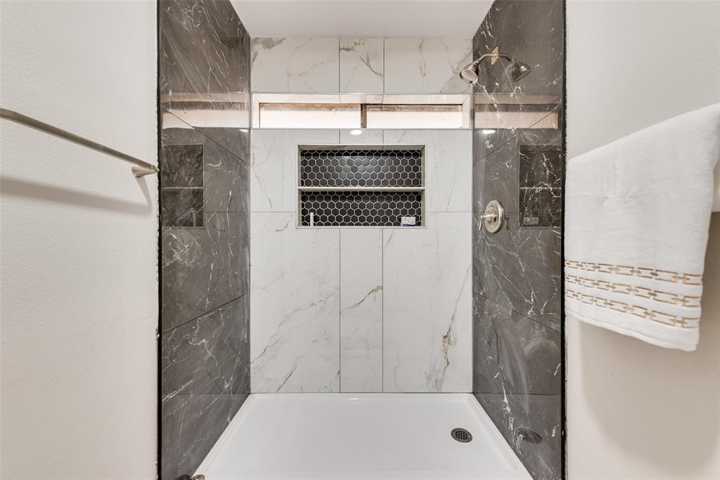 4801 Rock Ridge Court Arlington, TX 76017 - Photo 26 of 27 a bathroom with a shower