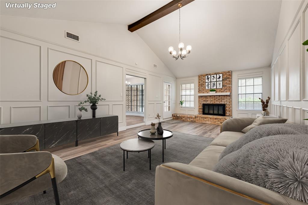 4801 Rock Ridge Court Arlington, TX 76017 - Photo 7 of 27 a living room with furniture a fireplace and a chandelier