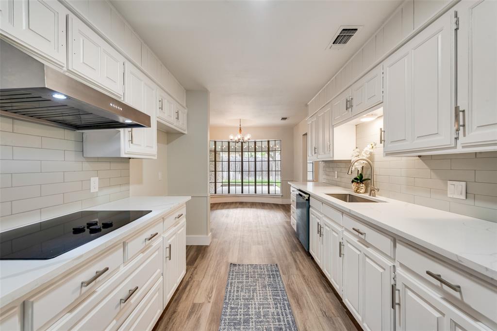 4801 Rock Ridge Court Arlington, TX 76017 - Photo 8 of 27 a kitchen with stainless steel appliances a sink stove and cabinets