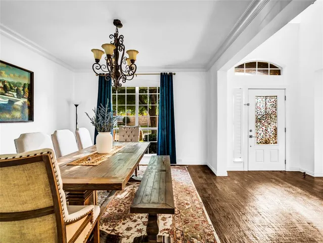 a living room with a couch and a wooden floor
