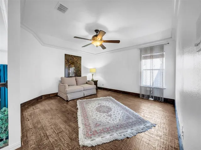 a living room with furniture and a rug