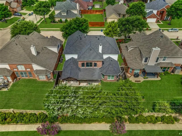 an aerial view of a house with a garden