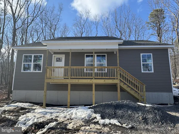 a house view with a backyard space