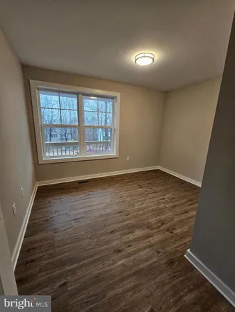 a kitchen with granite countertop stainless steel appliances and wooden cabinets