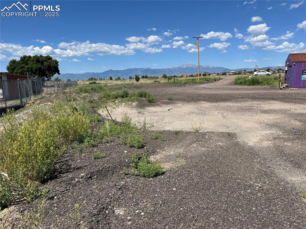 7110 Old Meridian Road Peyton, CO 80831 - Photo 13 of 26 a view of a lake with sunset
