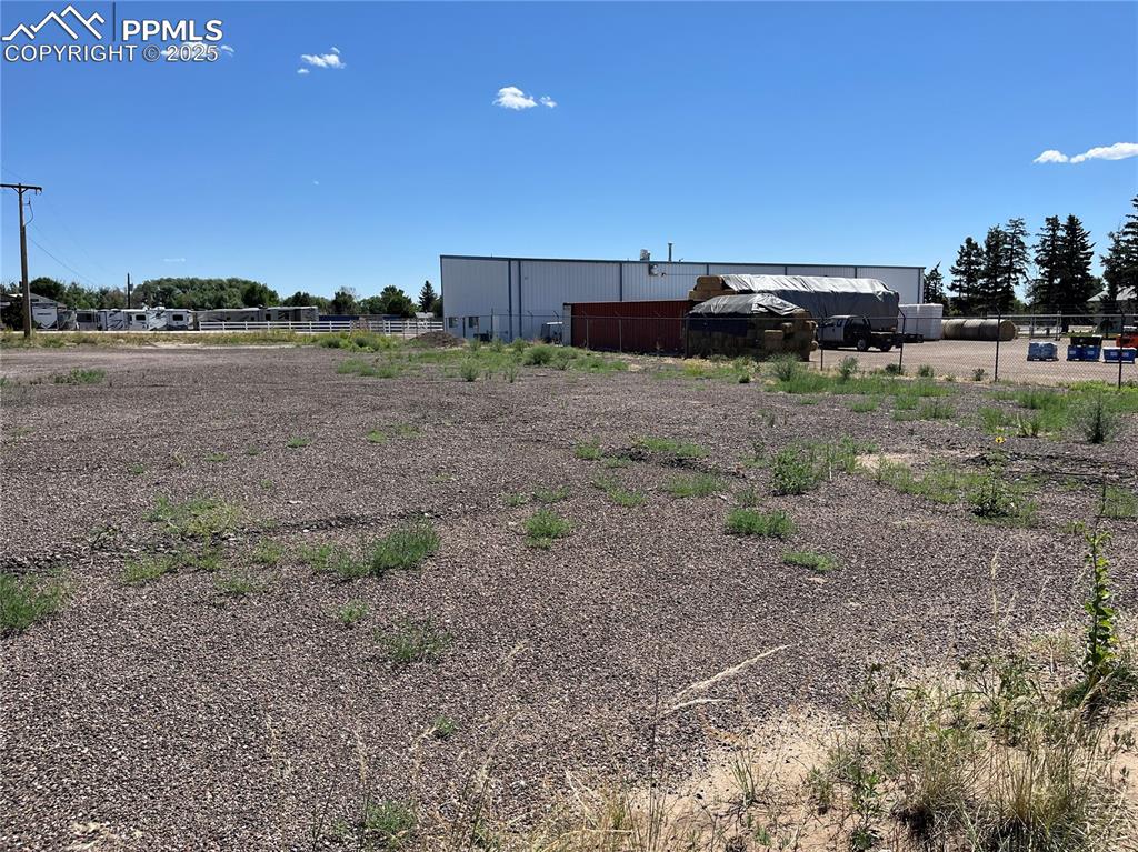 7110 Old Meridian Road Peyton, CO 80831 - Photo 20 of 26 a view of a dry yard with an trees