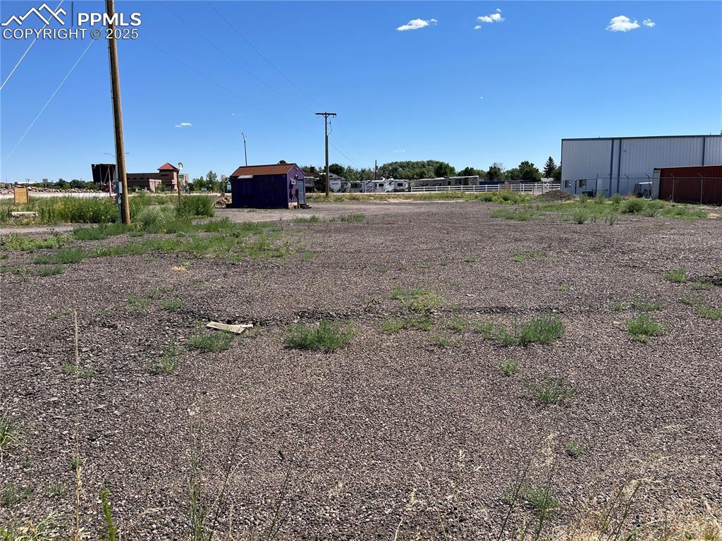 7110 Old Meridian Road Peyton, CO 80831 - Photo 21 of 26 a view of a dry yard with wooden fence
