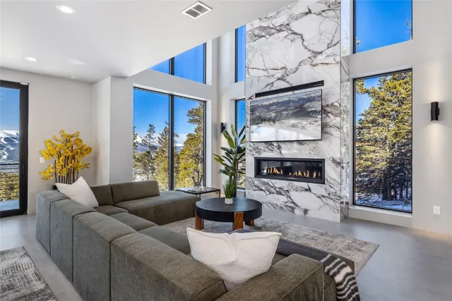 a living room with furniture and a table