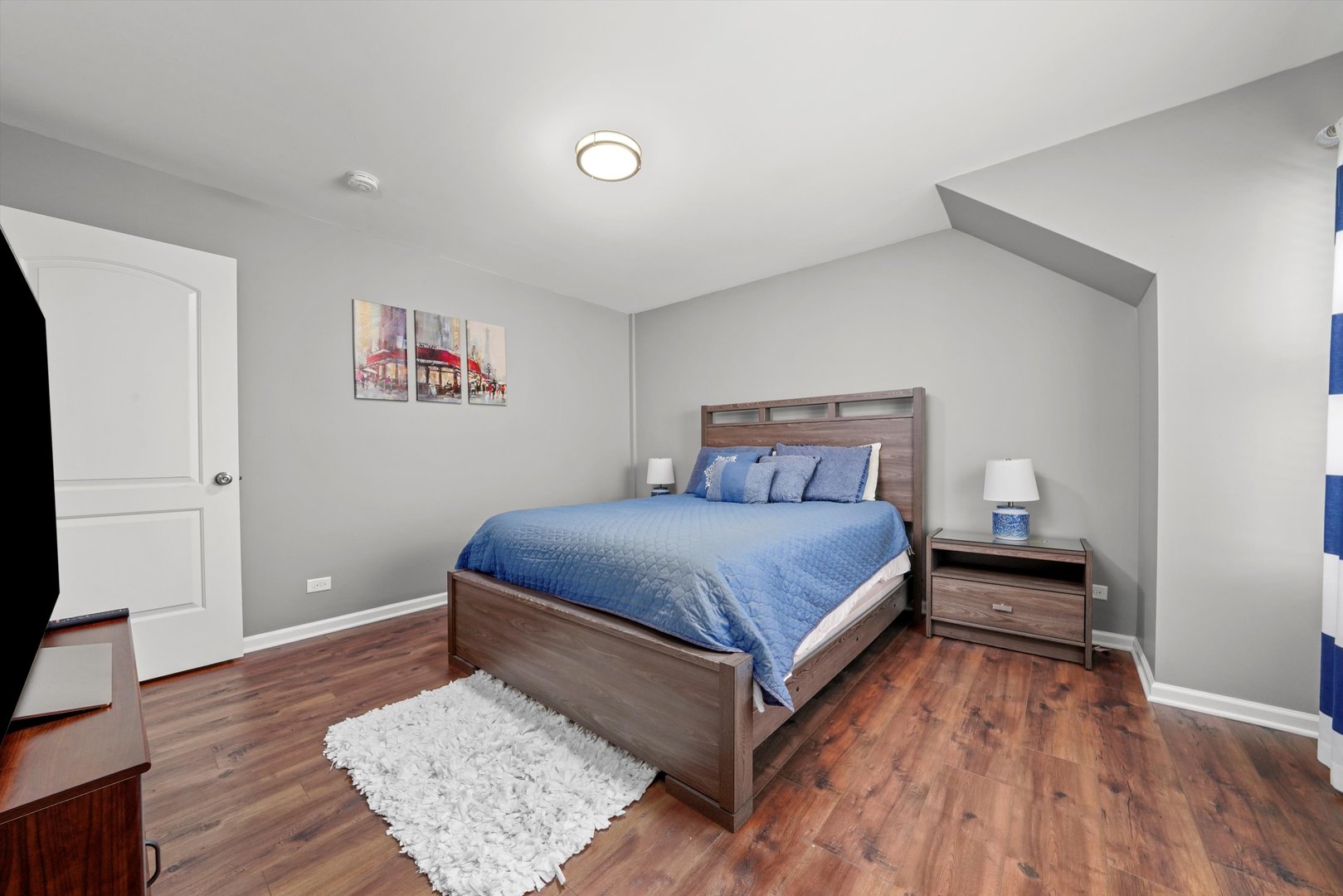 749 North Misty Ridge Drive Romeoville, IL 60446 - Photo 12 of 44 a bedroom with a bed and wooden floor