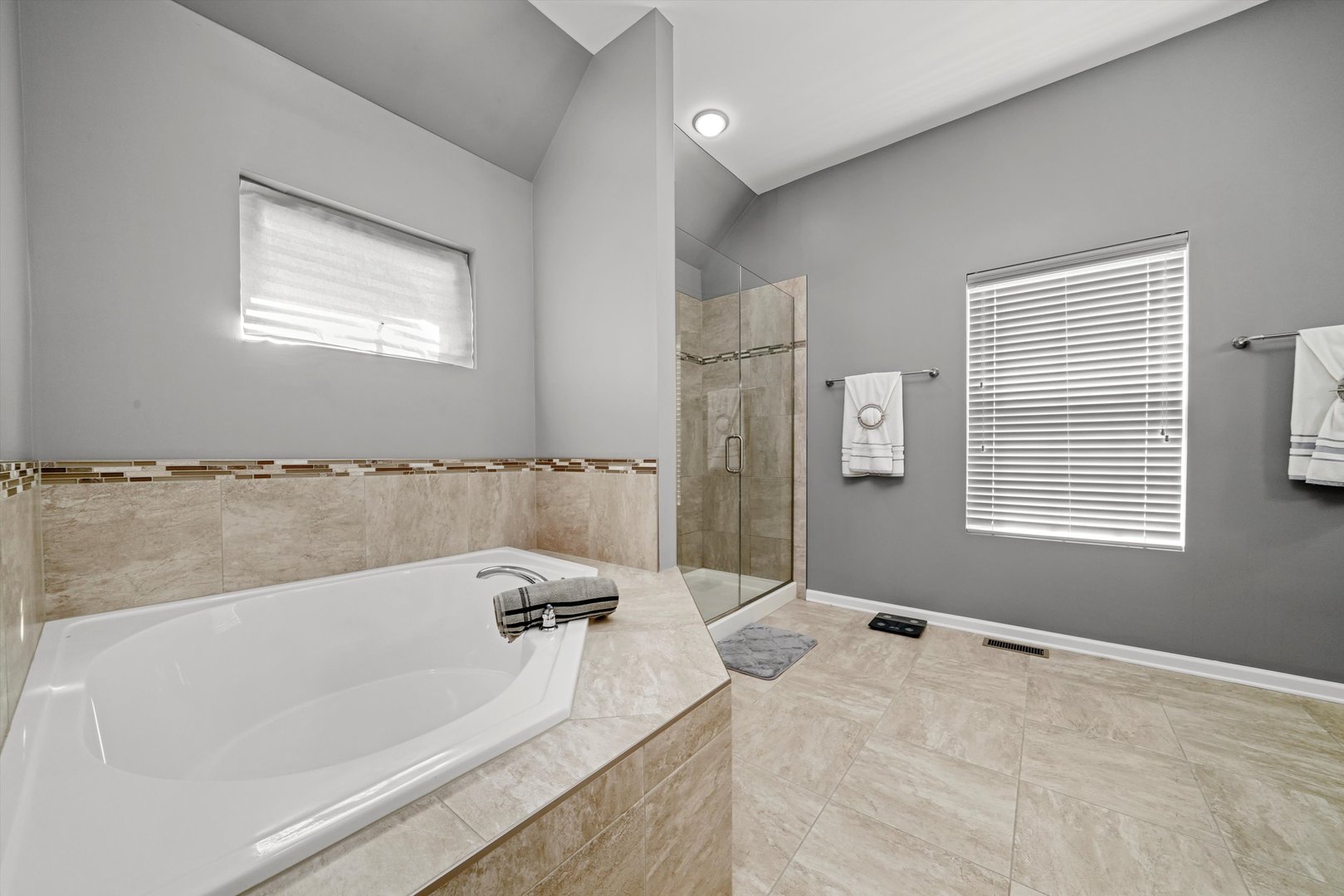 749 North Misty Ridge Drive Romeoville, IL 60446 - Photo 17 of 44 a bathroom with a bathtub and a shower