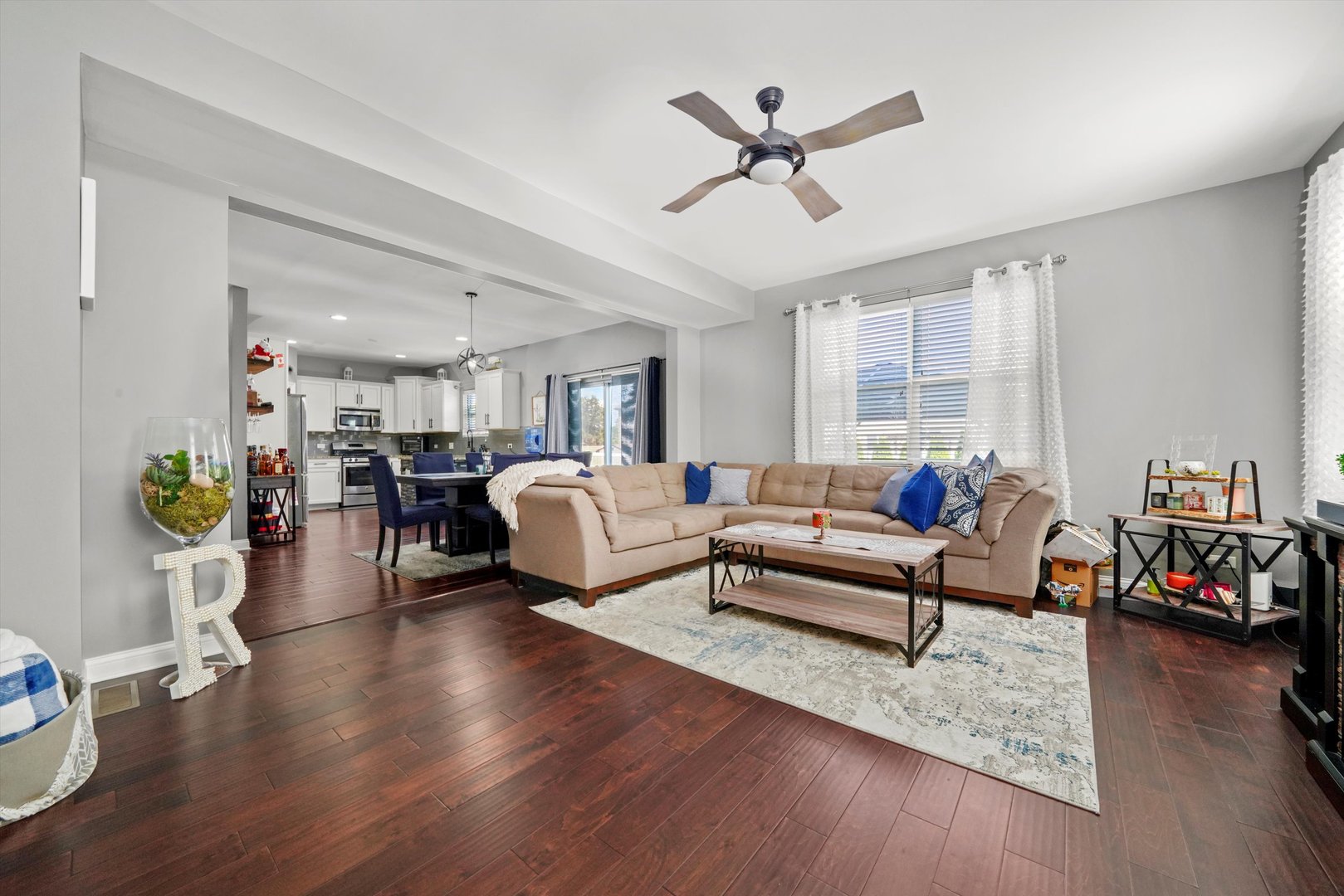 749 North Misty Ridge Drive Romeoville, IL 60446 - Photo 2 of 44 a living room with furniture and a wooden floor
