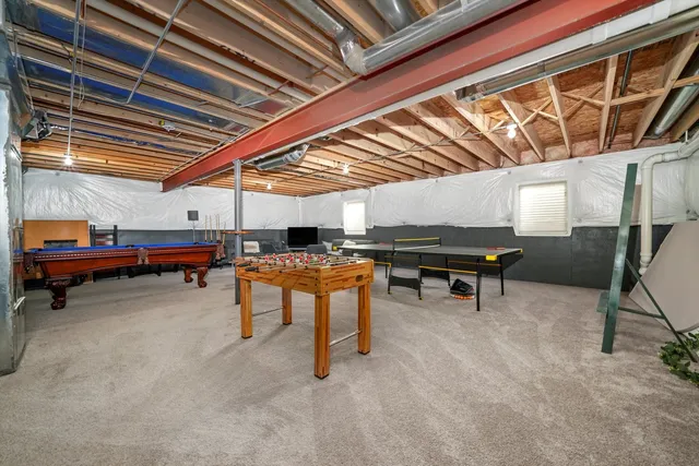 a view of a room with wooden furniture