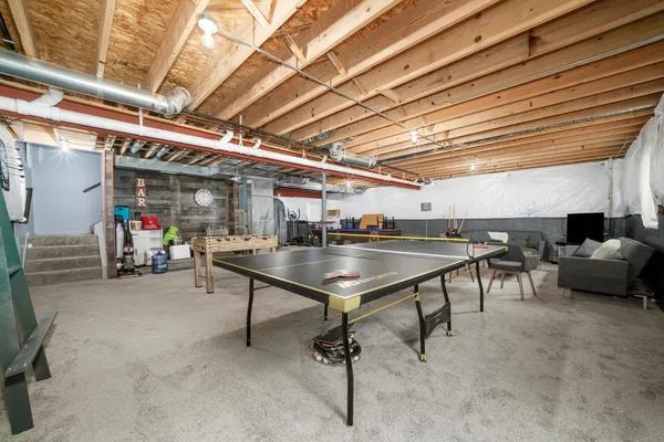 a view of a studio with furniture and a table
