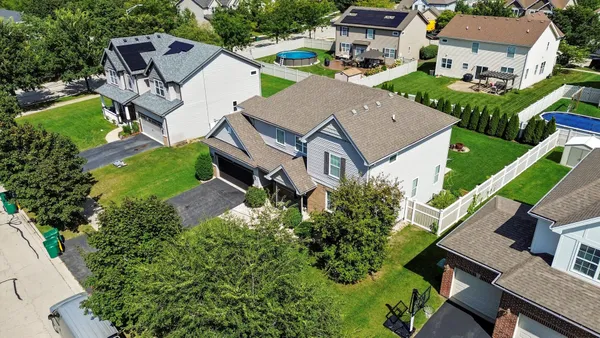 an aerial view of a house with a garden and plants