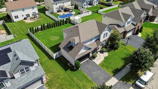 an aerial view of a house with a garden