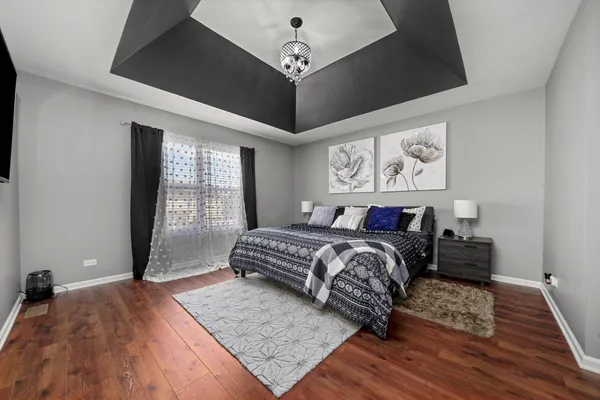 a bedroom with a large bed and a window