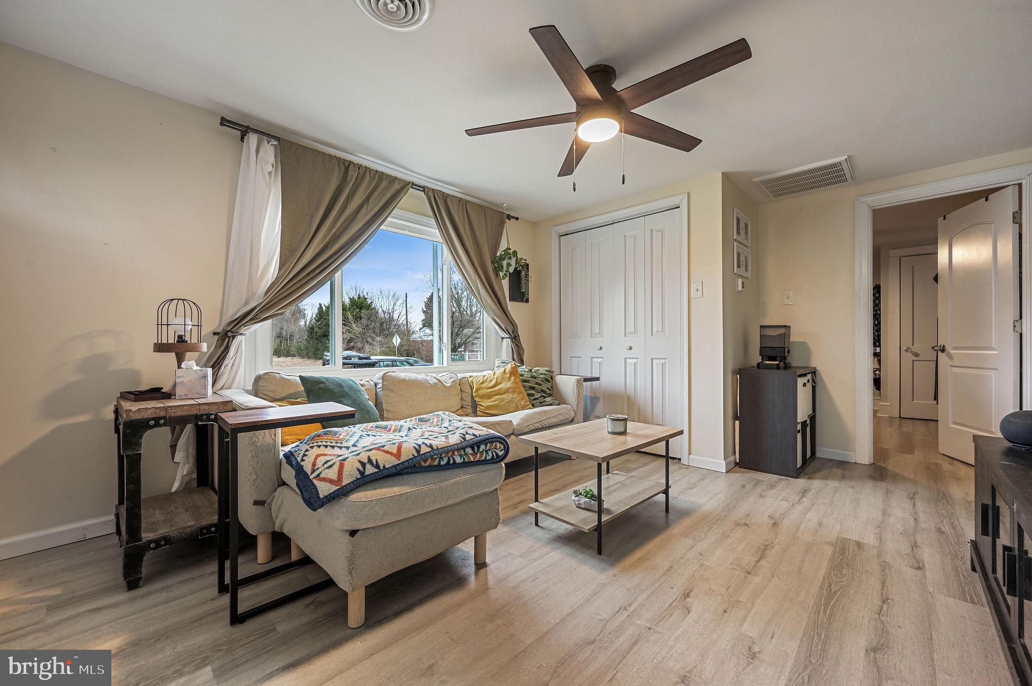 1014 White Oak Road Dover, DE 19901 - Photo 4 of 17 a living room with furniture and a wooden floor