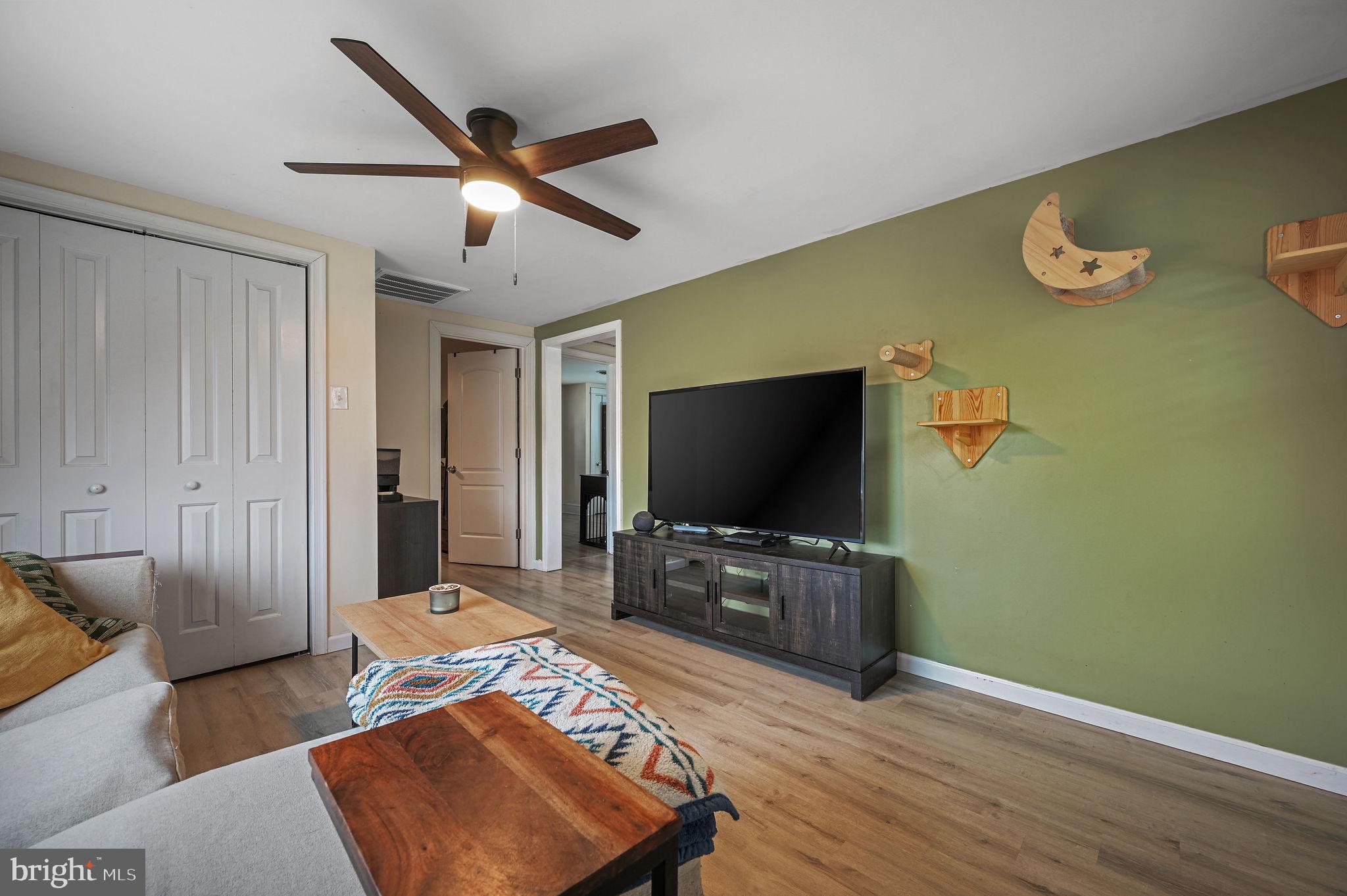 1014 White Oak Road Dover, DE 19901 - Photo 5 of 17 a living room with furniture and a flat screen tv