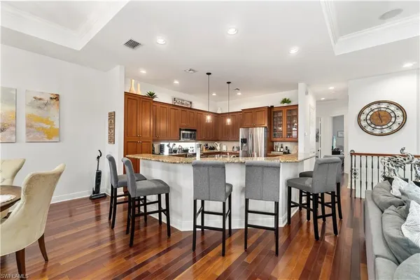 a view of a dining room with furniture wooden floor and chandelier