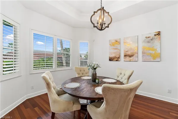 a kitchen with granite countertop a stove a sink dishwasher and a microwave oven with cabinets