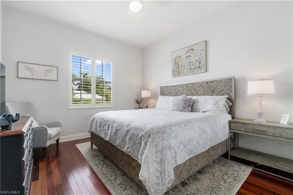 a bedroom with bed and a window