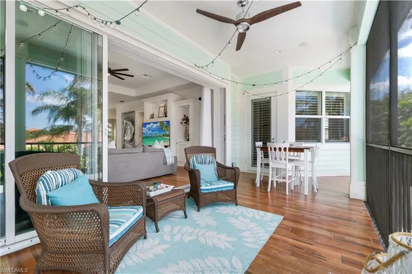 a living room with furniture and stairs