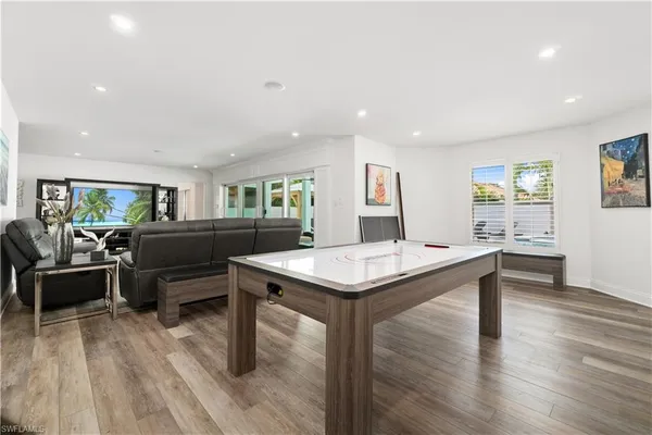 a spacious bedroom with a bed and a cabinets