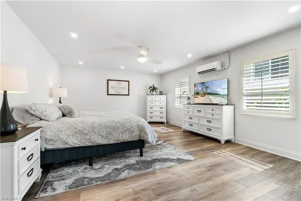 a bedroom with a bed and a dresser