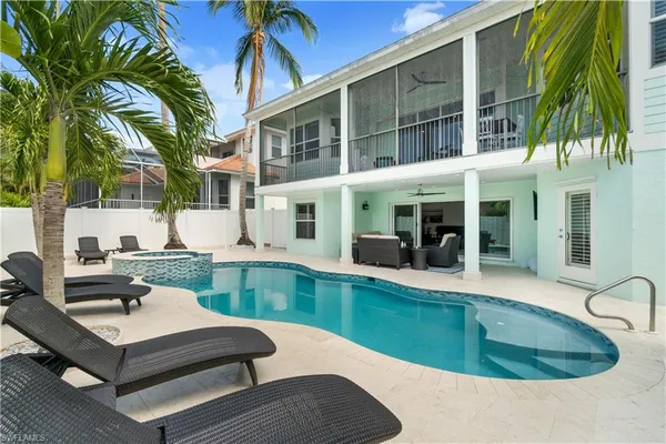 a patio with a patio table and chairs