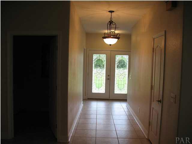 2555 Valley Road Navarre, FL 32566 - Photo 2 of 24 FOYER LEADING TO THE LEADED FRONT DOORS
