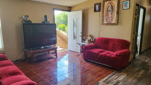 a living room with furniture and a rug