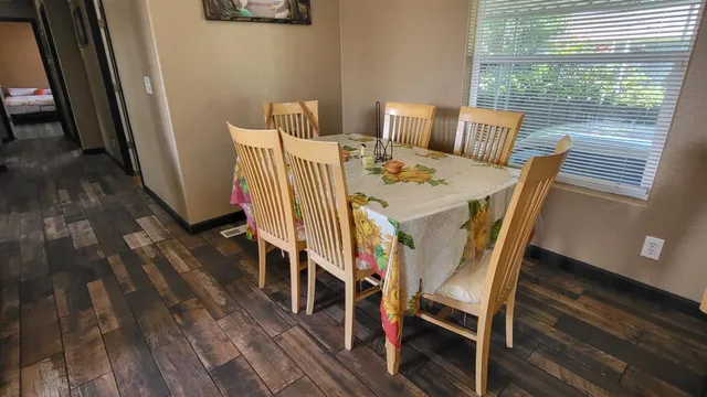 a view of a dining room with furniture window and wooden floor