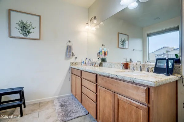 a bathroom with a sink a vanity and a mirror