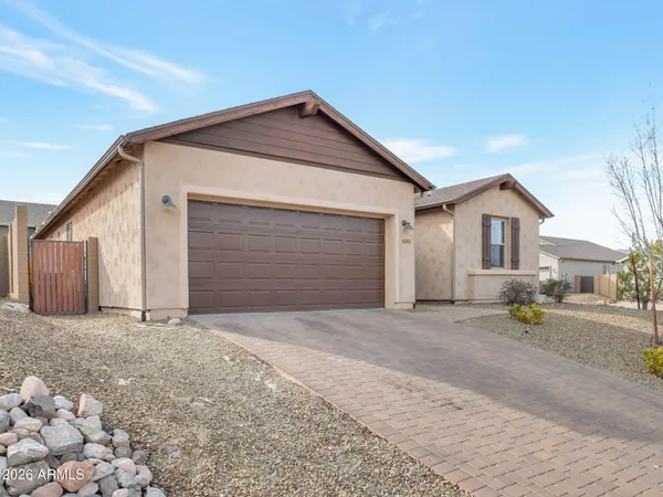 a front view of a house with a outdoor space