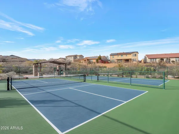 a view of an outdoor space and tennis court