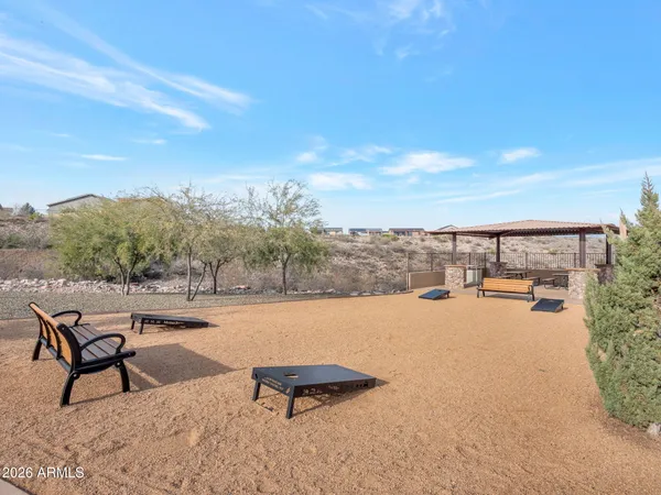 a terrace with outdoor seating and city view