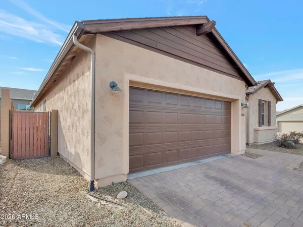 a view of small house with a garage