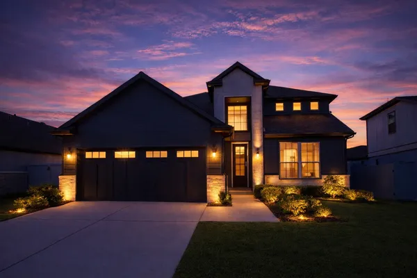 a front view of a house with a yard